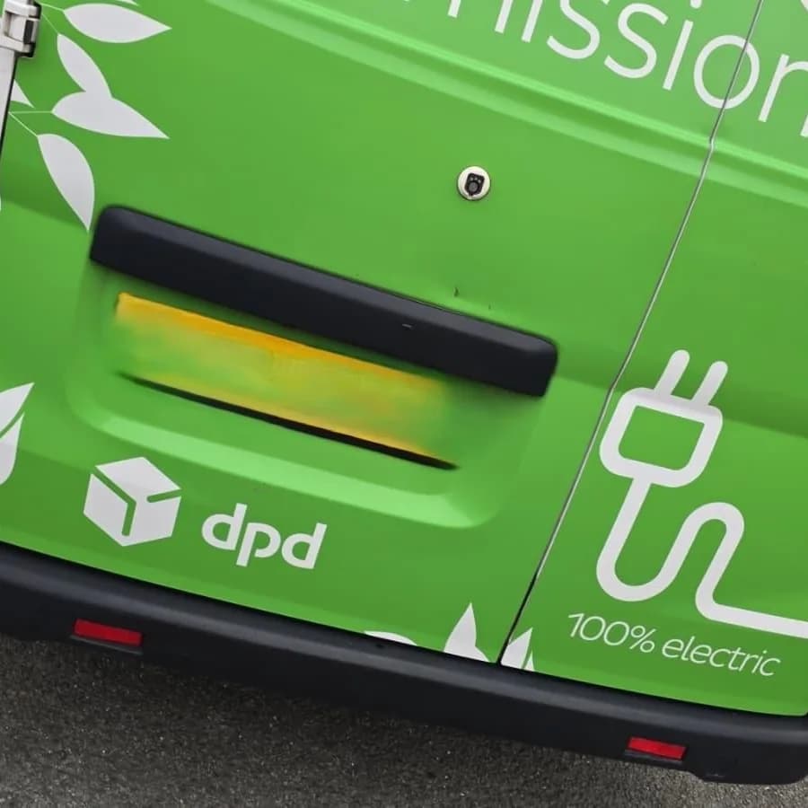 The rear doors of a green DPD electric delivery van.